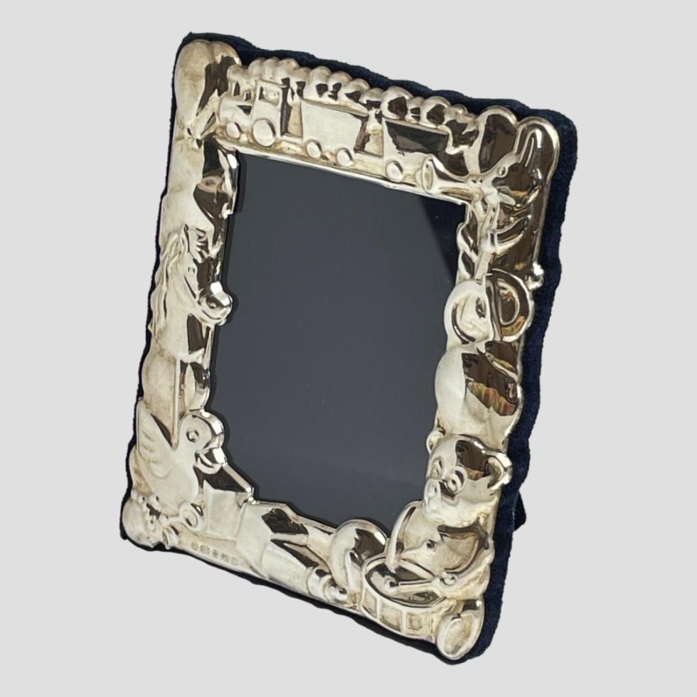 Photo of toy them photo frame this time shown from a slight side angle with front of frame facing bottom left.