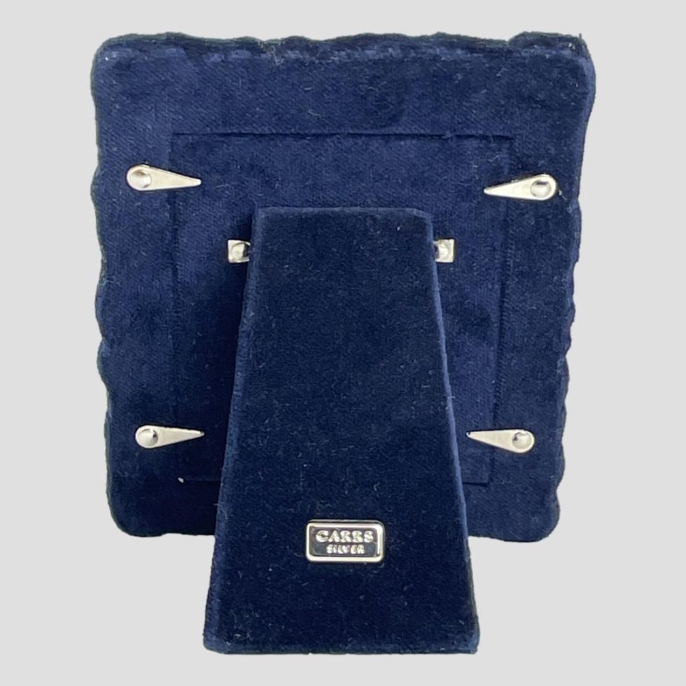 Photo of back of toy theme photo frame showing the blue velvet in good order.