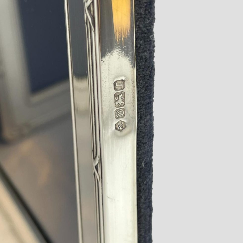 Close up photo of the full hallmark to the outside edge of one frame of the silver double photo frame