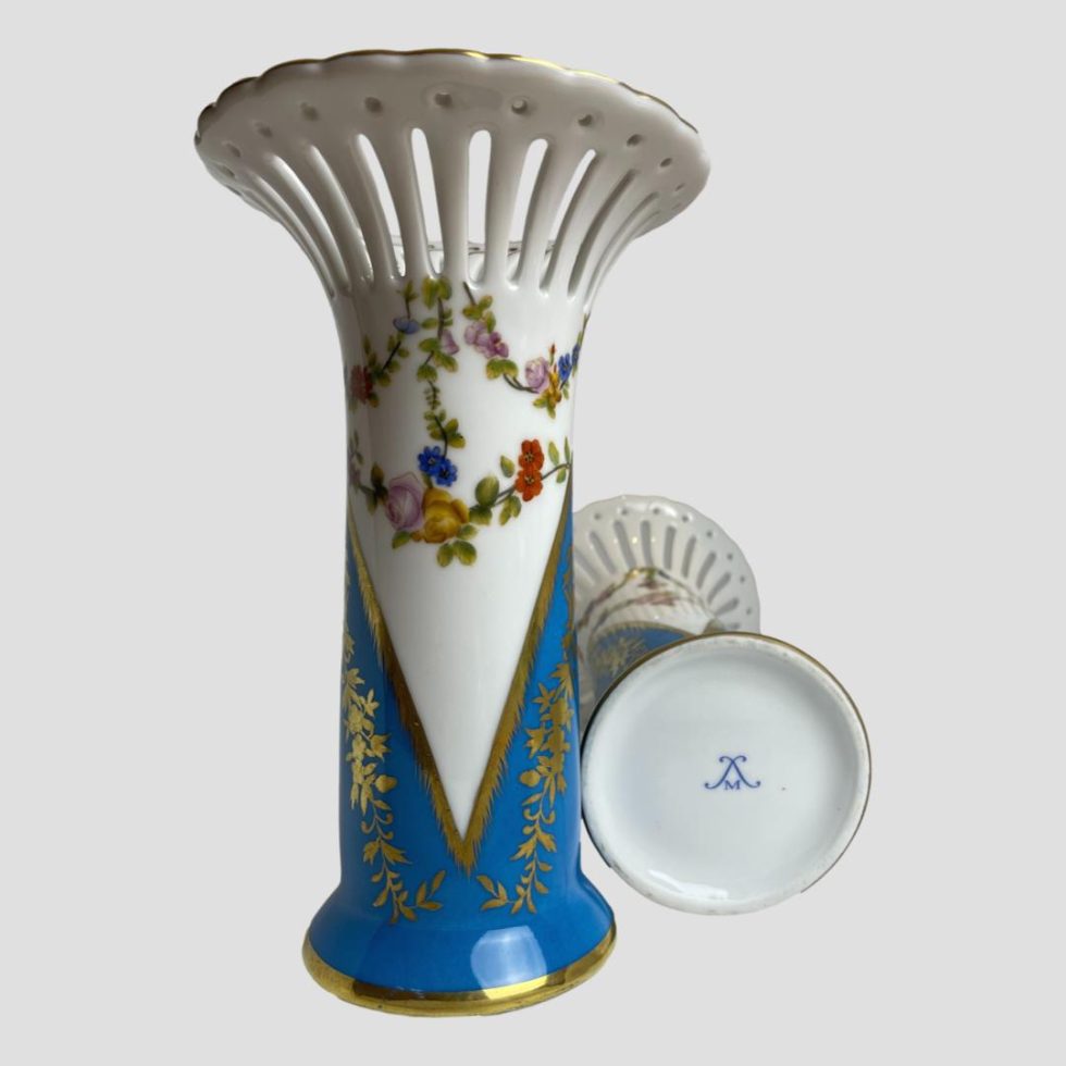 Photo of Sêvres style porcelain vases with one on left upright and other laid flat showing the unidentified makers mark on the base.