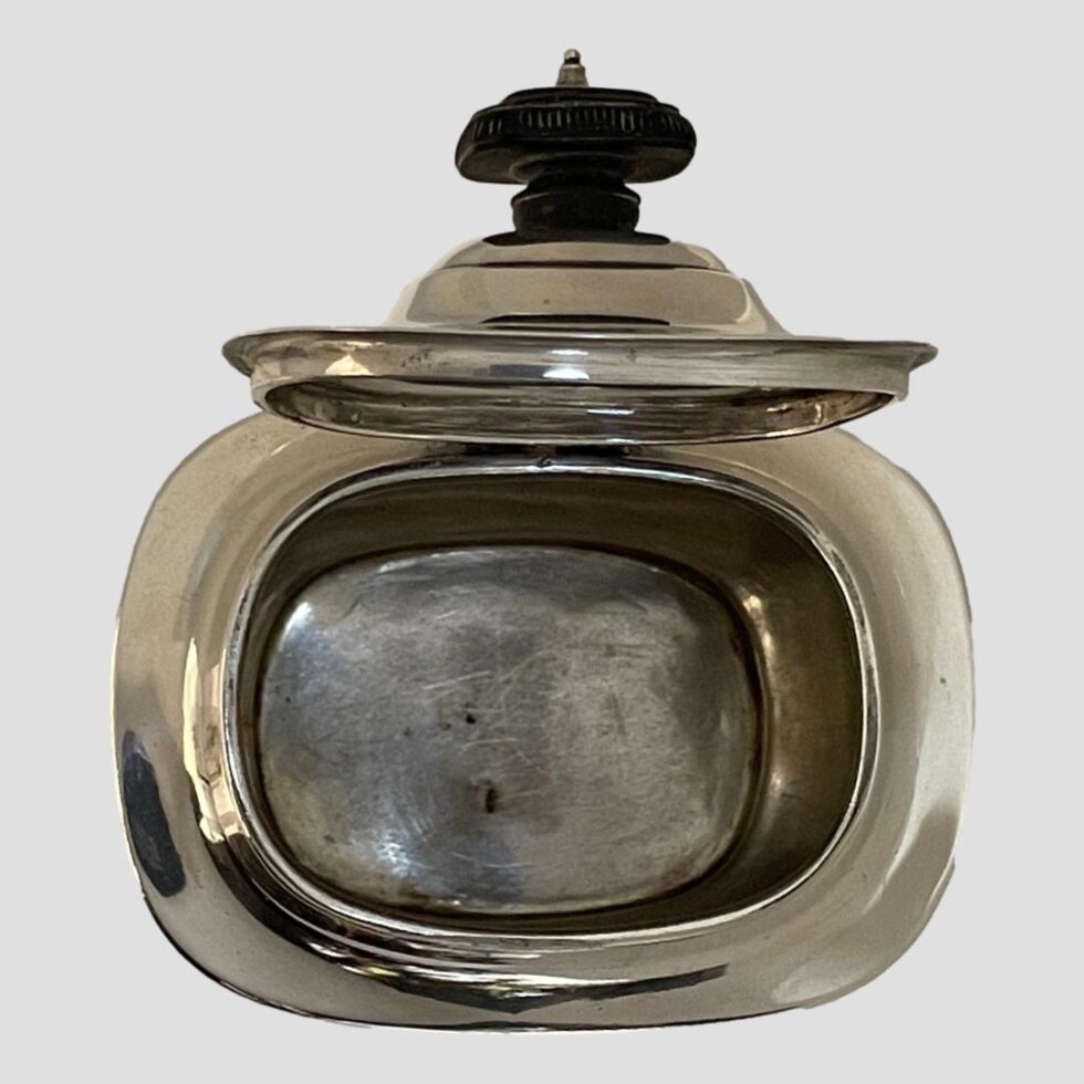 Photo of tea caddy with lid open and looking down into the body of the caddy.