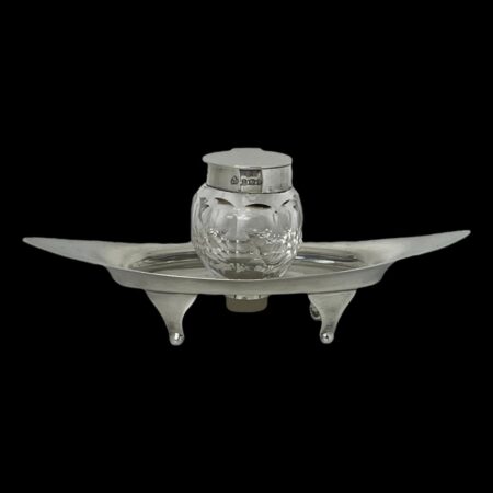 Main photo of Asprey silver & crystal inkwell seen from a near eye level.