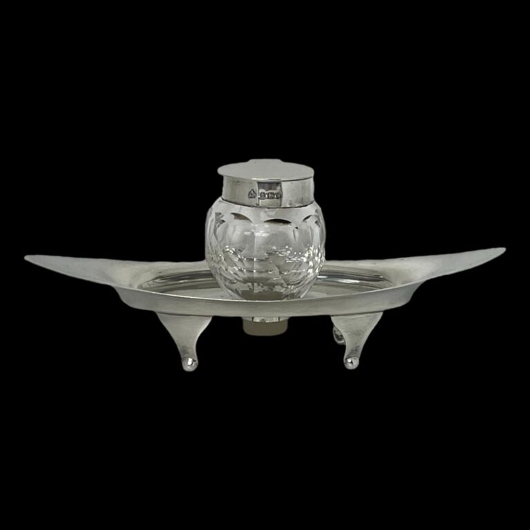 Main photo of Asprey silver & crystal inkwell seen from a near eye level.