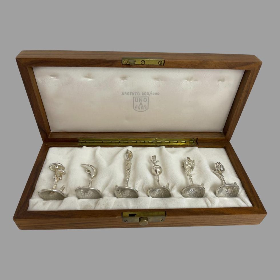 Photo of all 6 Italian name card holders displayed inside their fitted wooden case.