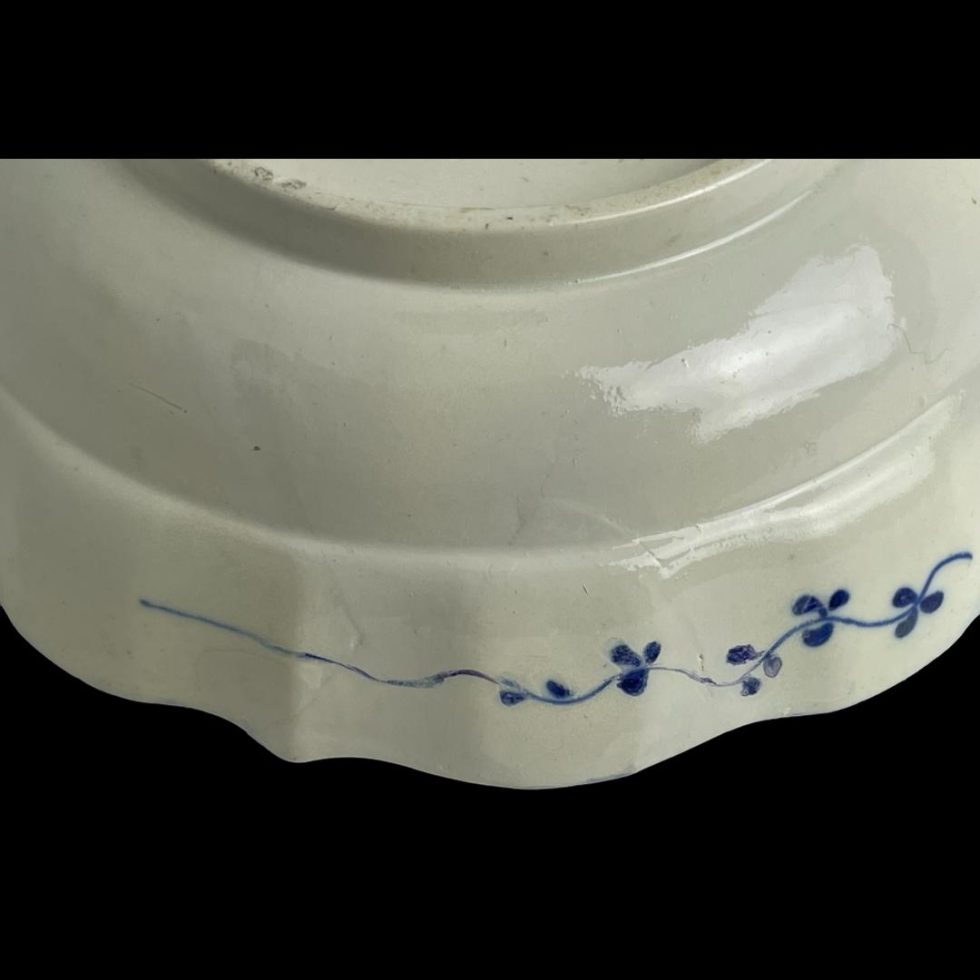 Close up photo of the repair made to one area of the saucer rim.