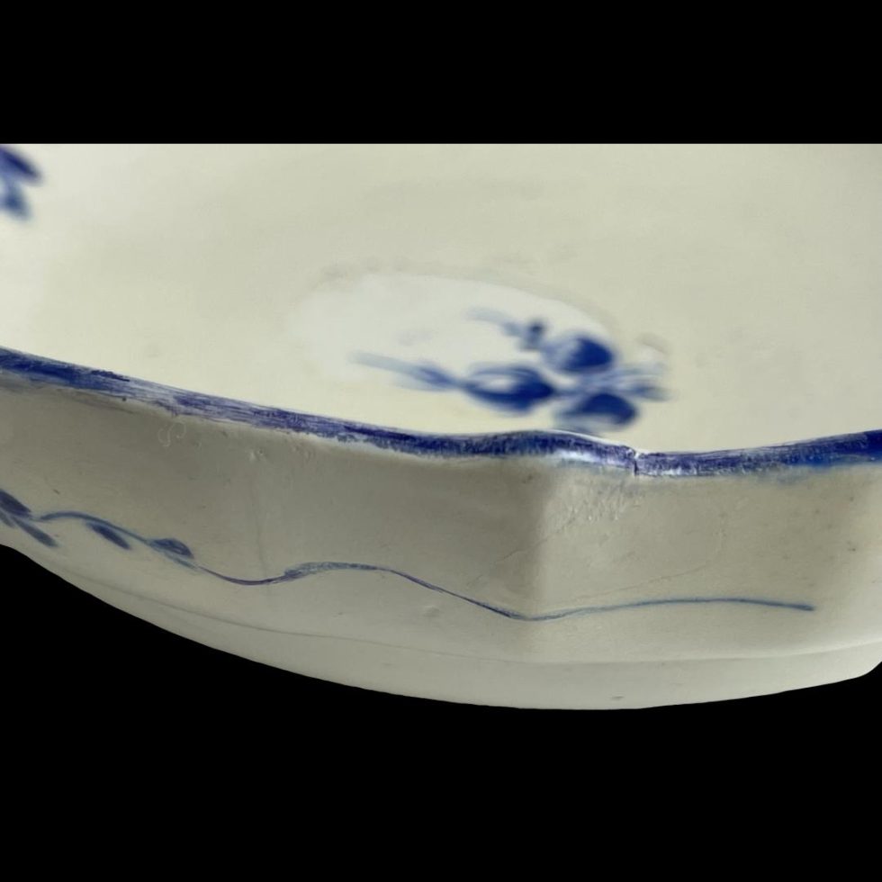 Close up photo of the faded blue rim of the saucer.