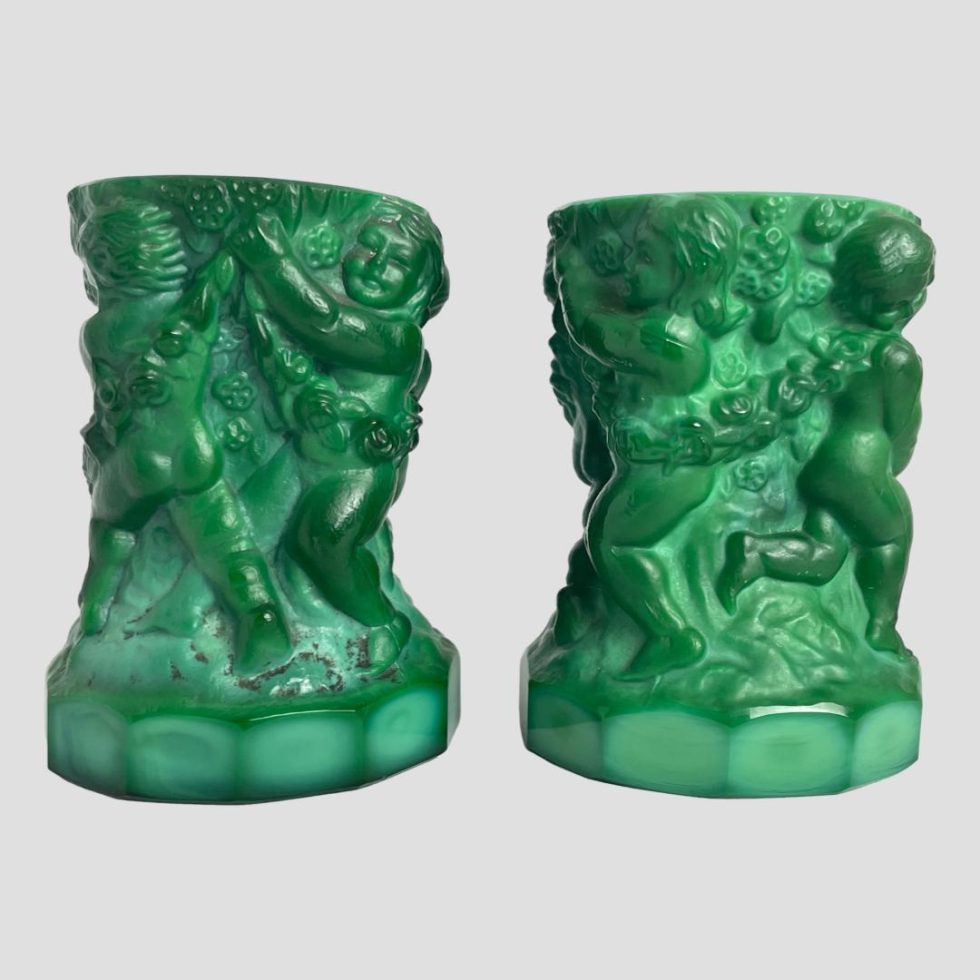 Another side view of malachite glass putti pots with different cherubs this time.