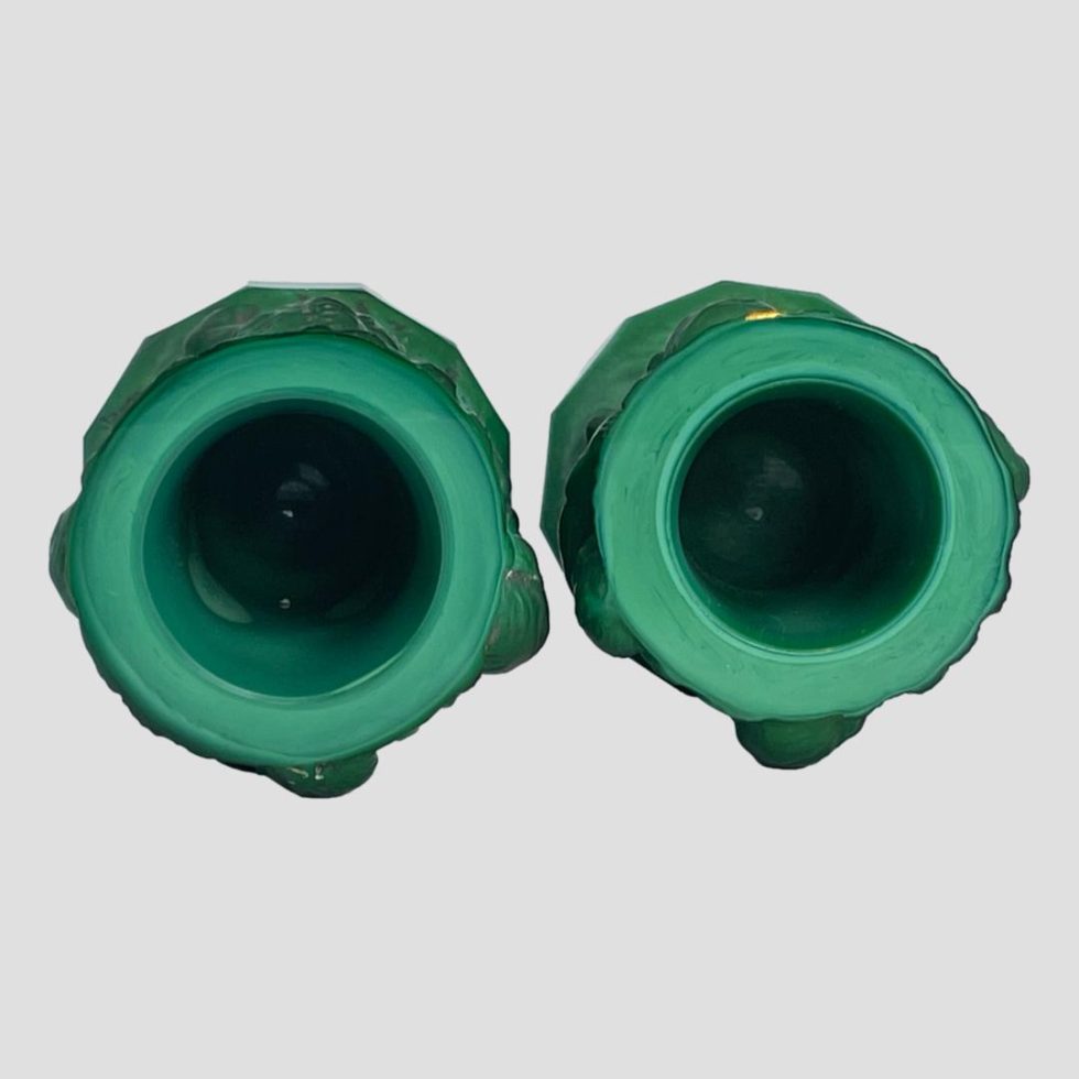 Photo looking into the mouth of both malachite glass putti pots. Both pots are in good clean condition.