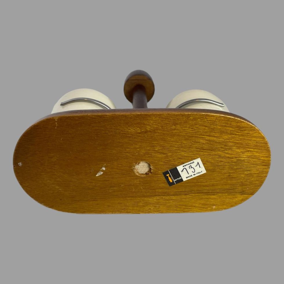 Photo showing the base of the Alvar Aalto salt and pepper stand with the original Italian sticker still attached.