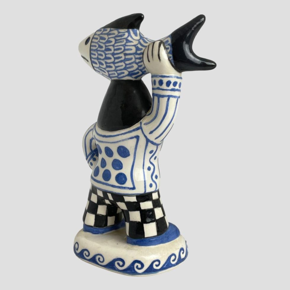 Photo of Bernard Moss fisherwoman figure this time with the woman facing towards the top right corner. Her raised arm is to the bottom right corner