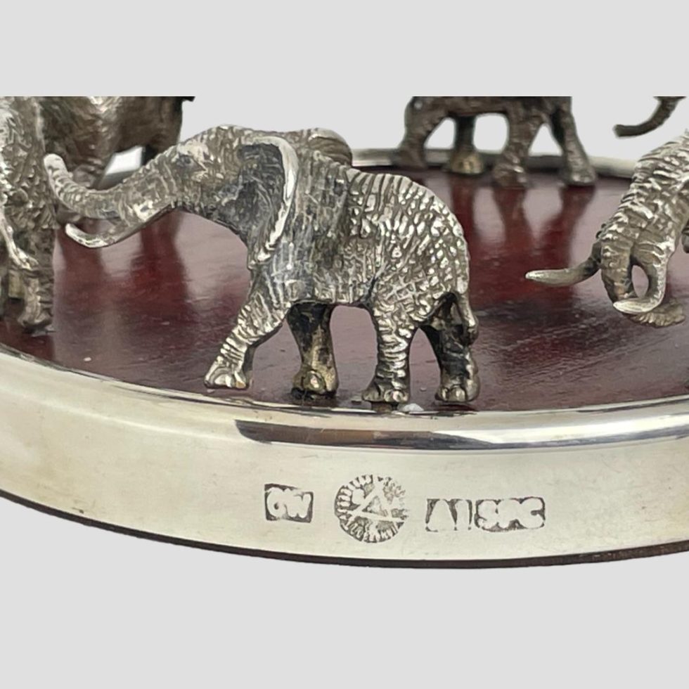 Close up photo of the hallmark on the outer rim edge of the elephants wine bottle coaster.