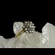 Min photo of .50 carat diamond ring displayed on top of a rock of natural quartz crystal with the ring front facing towards the light on the right catching the sparkle of the stones. The background colour is black enhancing the sparkles further.