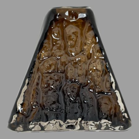 Main photo of Whitefriars pyramid bark vase displayed pyramid side on display! The glass on the wide flat sides is textured like tree bark. Lovely brown cinnamon colour.
